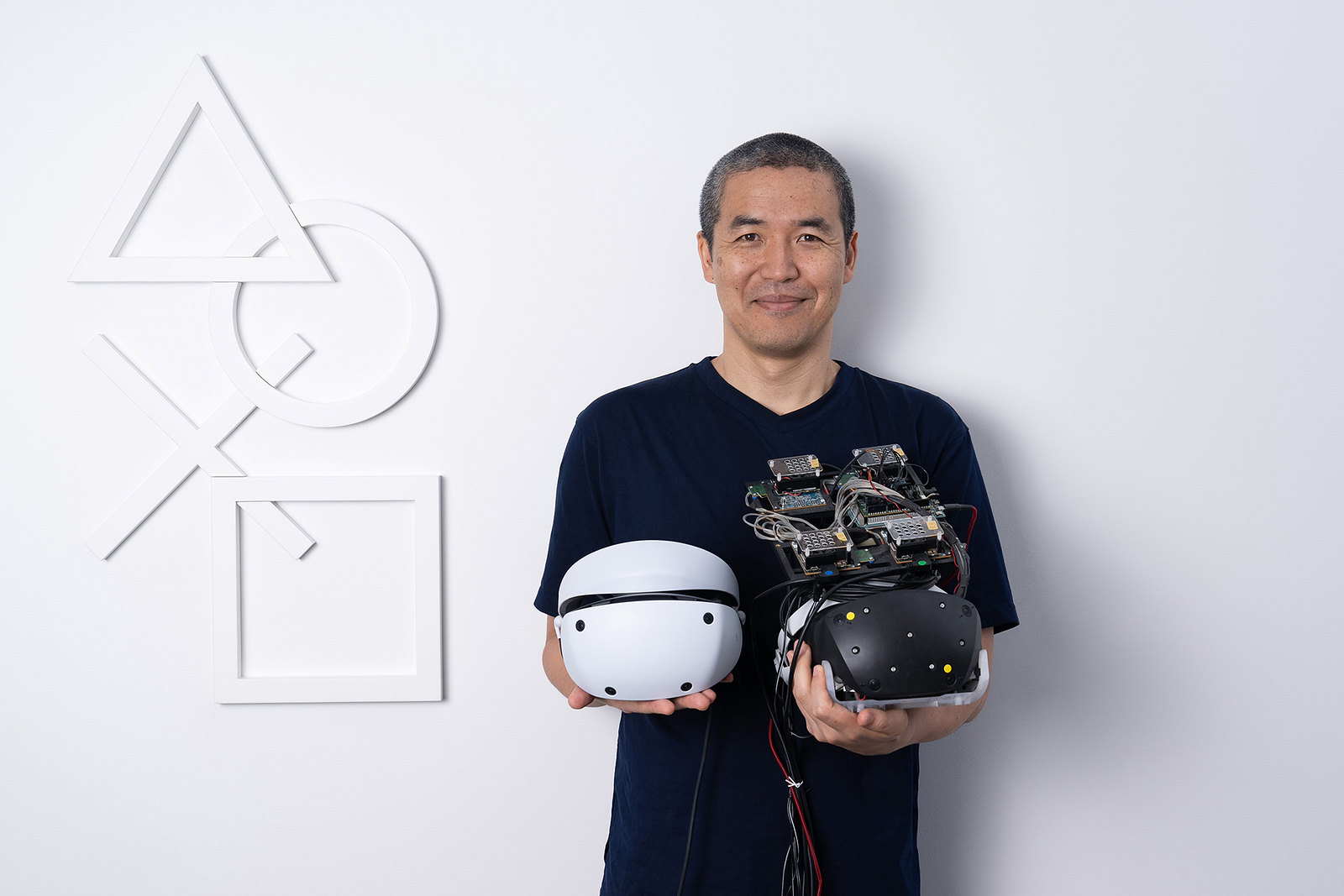 Yasuo Takahashi, with the Prototype PSVR2 vs the final design